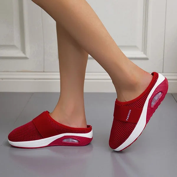 Women's orthopedic breathable slippers in pink, combining fashion with foot support.