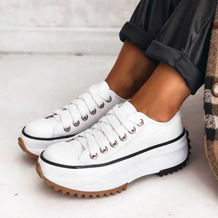 "Women's platform comfort sneakers with supportive sole, trendy design, breathable material in black, brown, white."