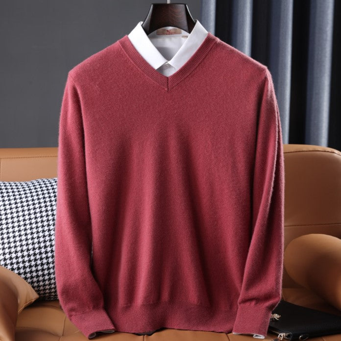 Women's premium cashmere V-neck sweater in soft pink, offering luxury and comfort with an elegant design.