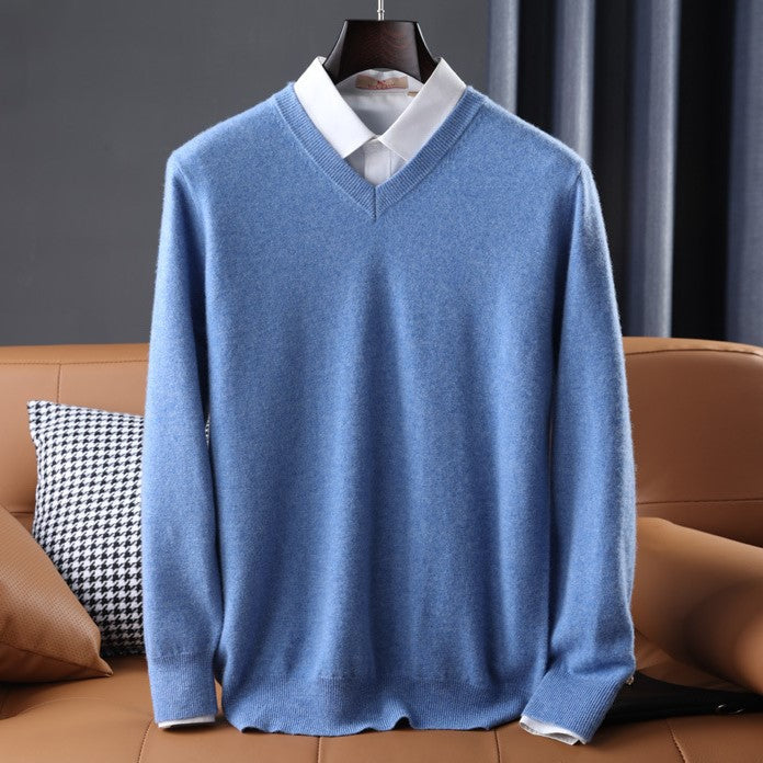 Women's premium cashmere V-neck sweater in soft pink, offering luxury and comfort with an elegant design.