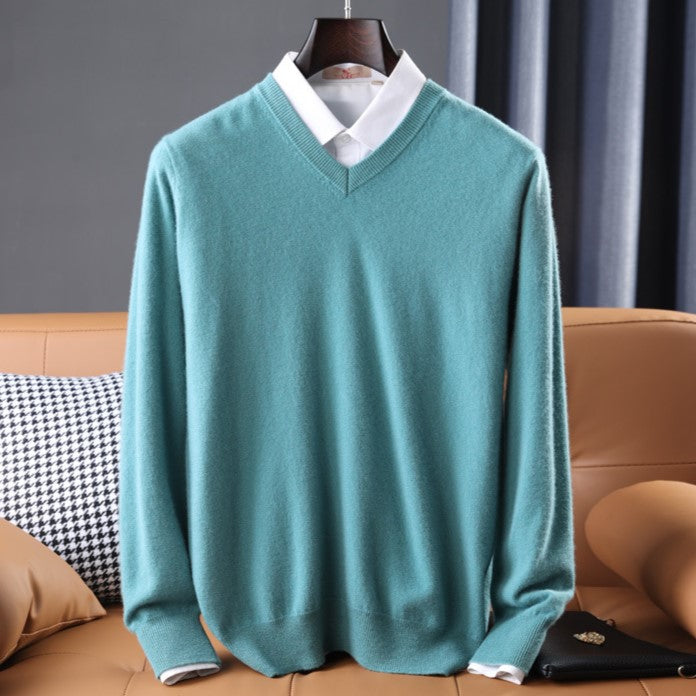 Women's premium cashmere V-neck sweater in soft pink, offering luxury and comfort with an elegant design.