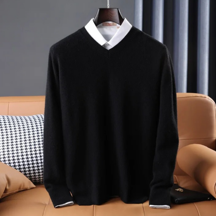 Women's premium cashmere V-neck sweater in soft pink, offering luxury and comfort with an elegant design.