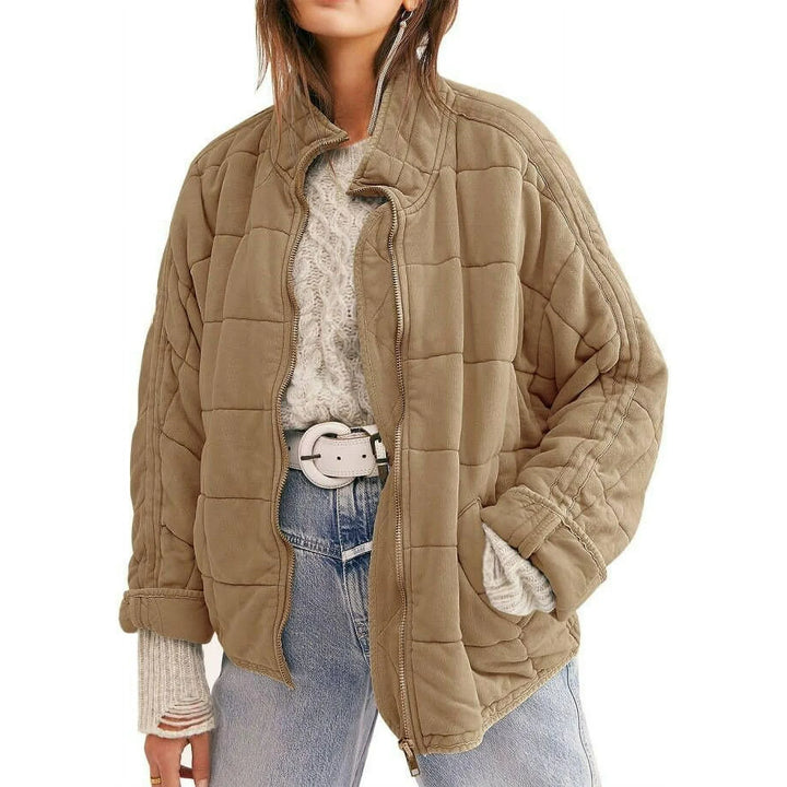"Women's quilted jacket front view; classic design, versatile; visual texture with balanced warmth, perfect for layering."