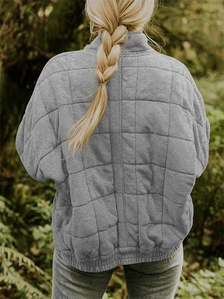 "Women's quilted jacket front view; classic design, versatile; visual texture with balanced warmth, perfect for layering."