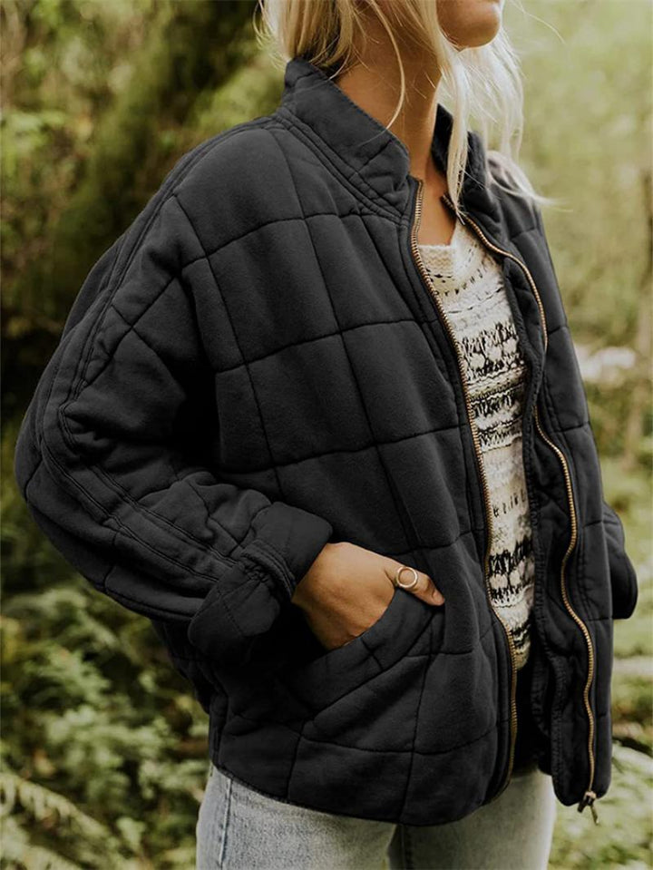 "Women's quilted jacket front view; classic design, versatile; visual texture with balanced warmth, perfect for layering."