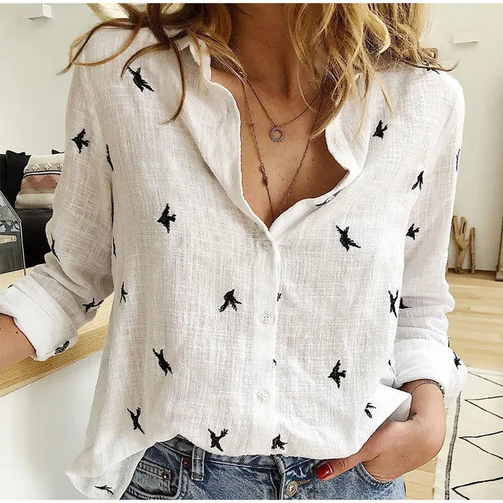 "Women's relaxed bird-print button-up blouse with colorful bird patterns, flowy silhouette, perfect for casual or office wear