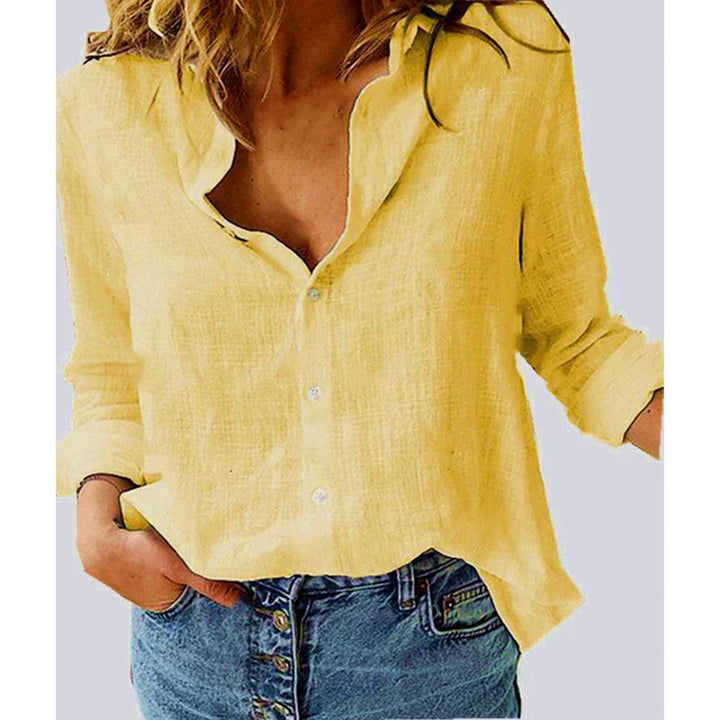 "Women's relaxed bird-print button-up blouse with colorful bird patterns, flowy silhouette, perfect for casual or office wear