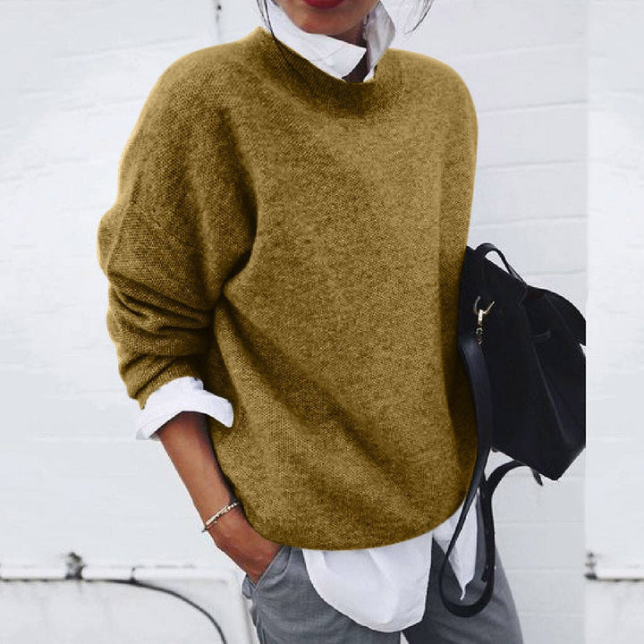 "Women's soft cashmere sweater, plush fabric, flattering fit, versatile style, shown in khaki, ideal for adding chic comfort.