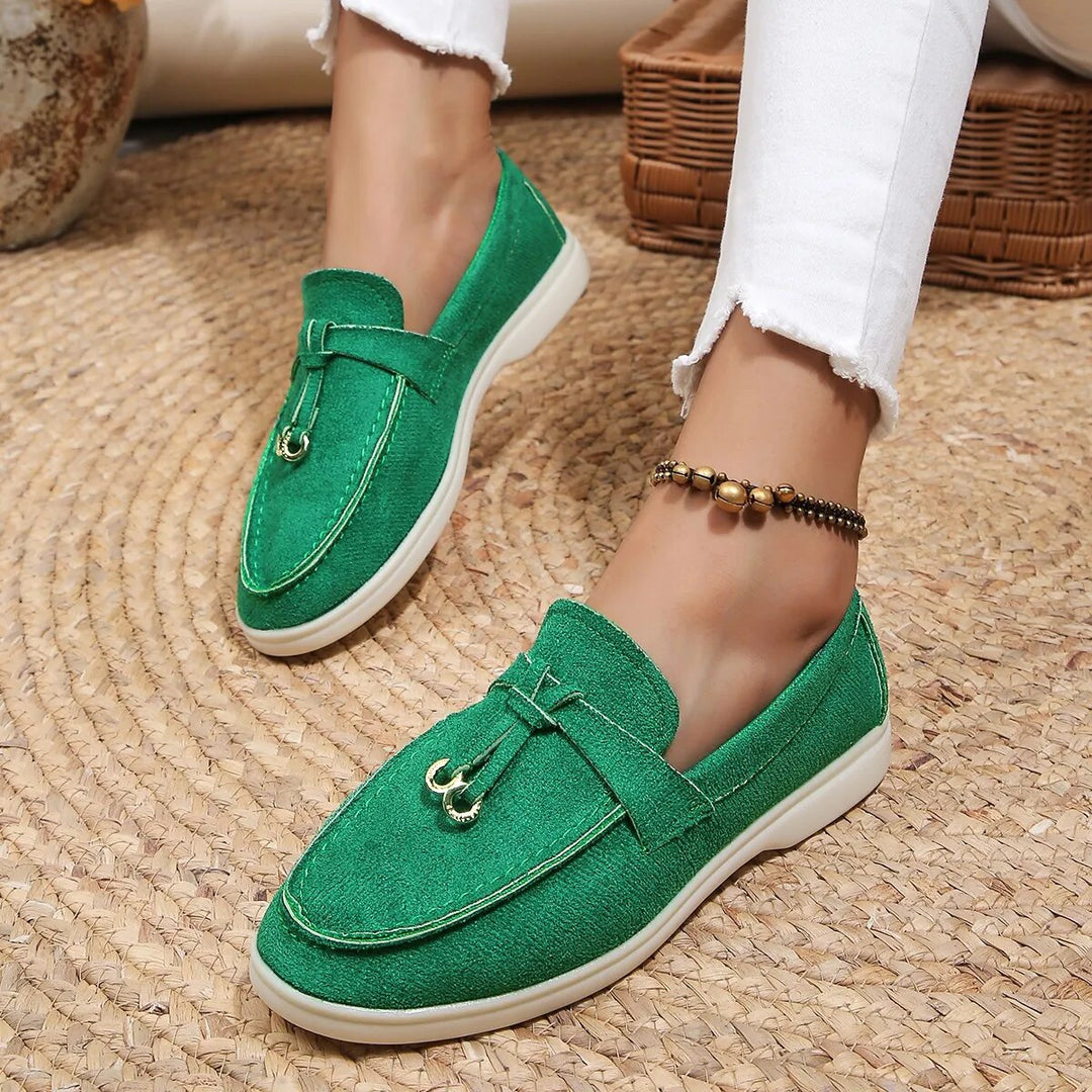Women's suede finish loafers in white, offering comfort and style. Perfect casual shoes for elegance and ease.