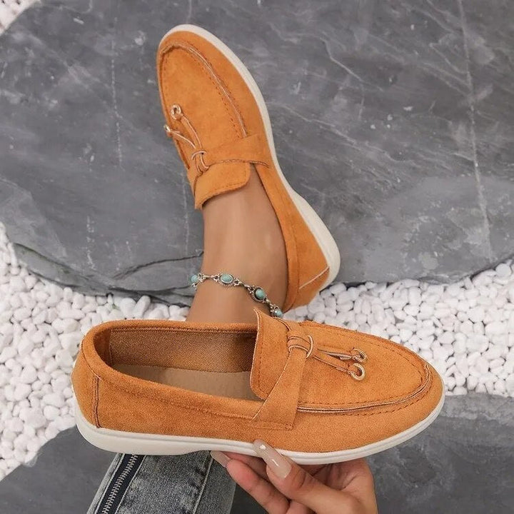 Women's suede finish loafers in white, offering comfort and style. Perfect casual shoes for elegance and ease.