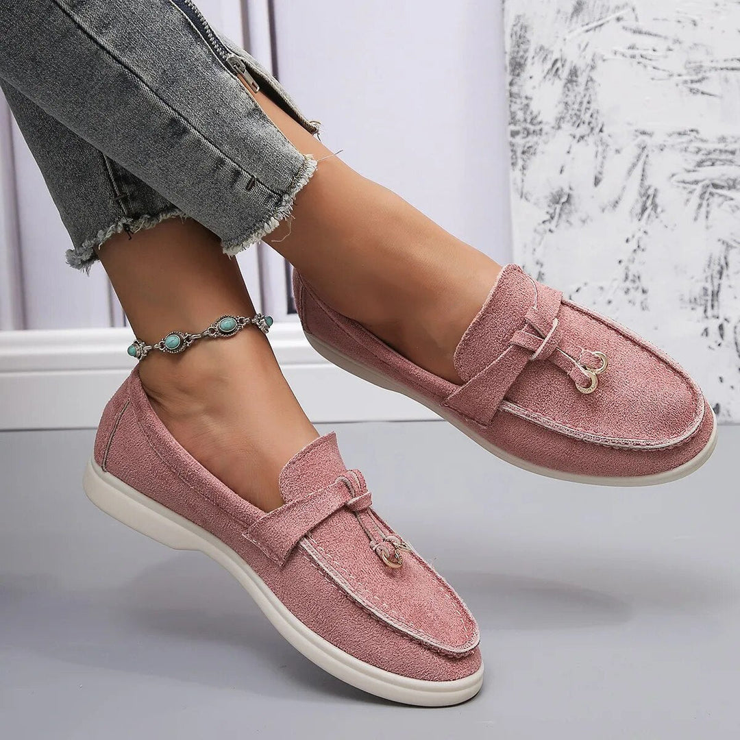 Women's suede finish loafers in white, offering comfort and style. Perfect casual shoes for elegance and ease.