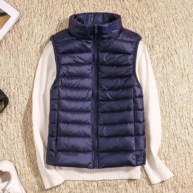 Women's ultra light down vest, stylish slim fit design, nylon material, stand collar, ideal for layering in autumn.