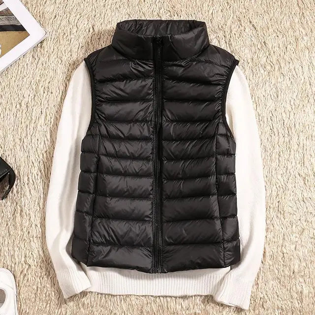 Women's ultra light down vest, stylish slim fit design, nylon material, stand collar, ideal for layering in autumn.