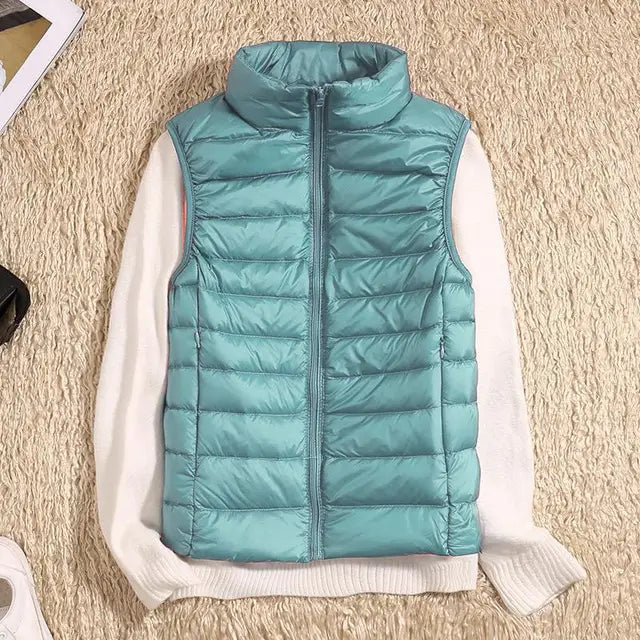 Women's ultra light down vest, stylish slim fit design, nylon material, stand collar, ideal for layering in autumn.