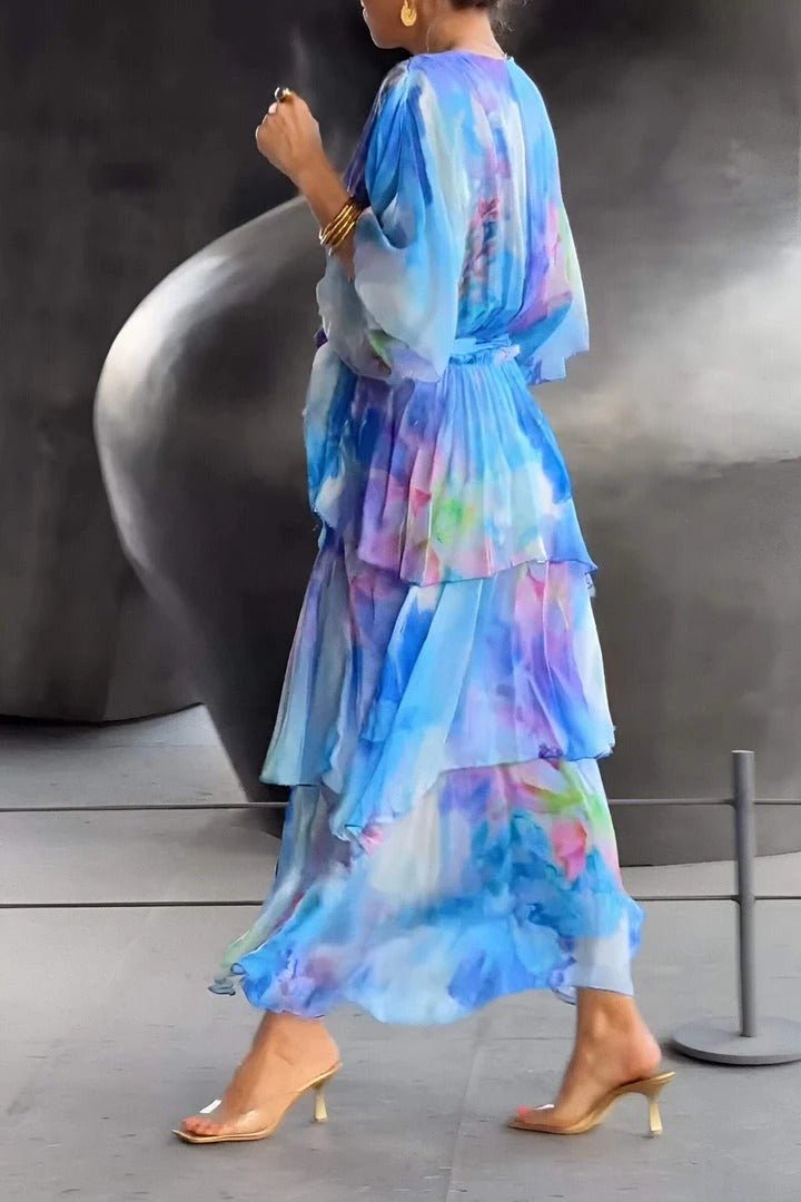 "Women's vibrant multi-colour maxi dress, flowing silhouette, side view highlighting elegant, colorful fabric design."