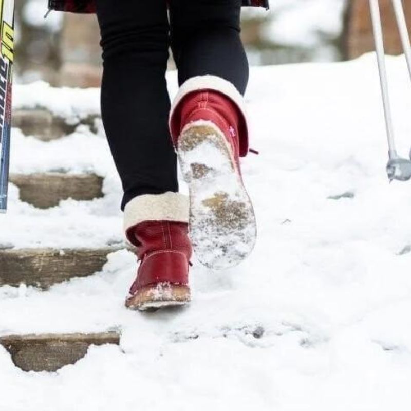 "Women's winter boots, waterproof leather with wool lining, offering style and warmth for cold weather conditions."