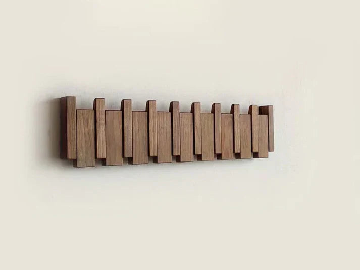 "Wooden piano coat rack with elegant piano-key design, made from beech and walnut wood, stylish home decor and organizer."