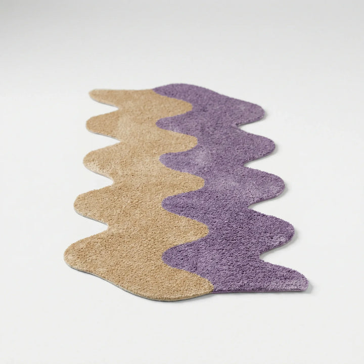 Vibrant abstract color block area rug with wavy design. Modern statement rug perfect for living room or bedroom decor.