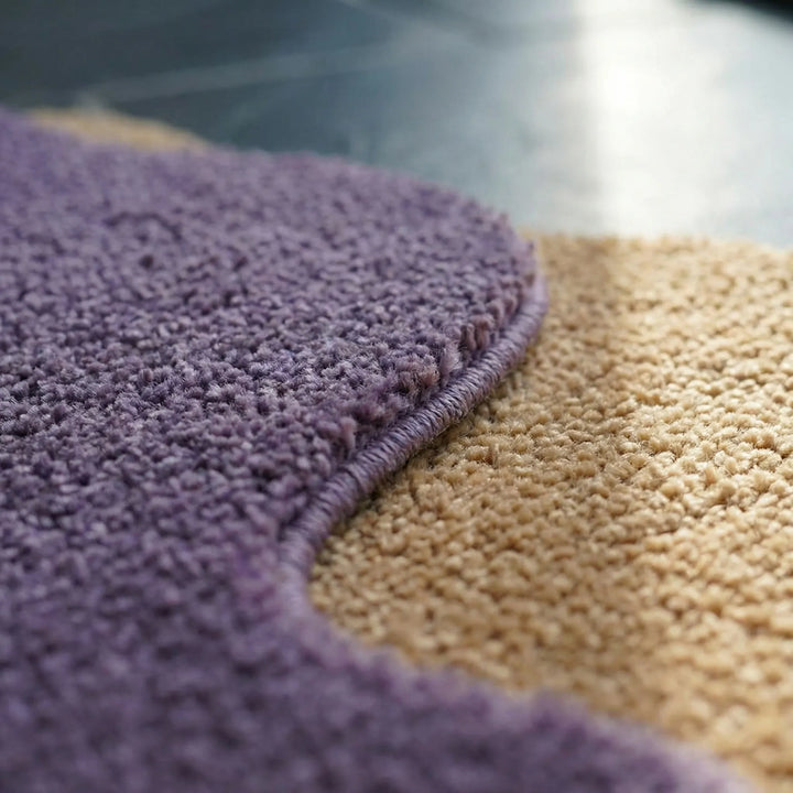 Washable abstract color block area rug. Flowique wavy design adds modern decor to kitchen, entryway, or bedroom.