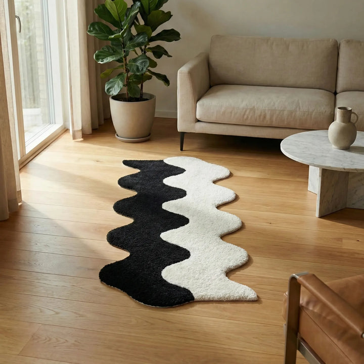 Eye-catching abstract color block area rug. Wavy design enhances modern home decor in entryways or any room.