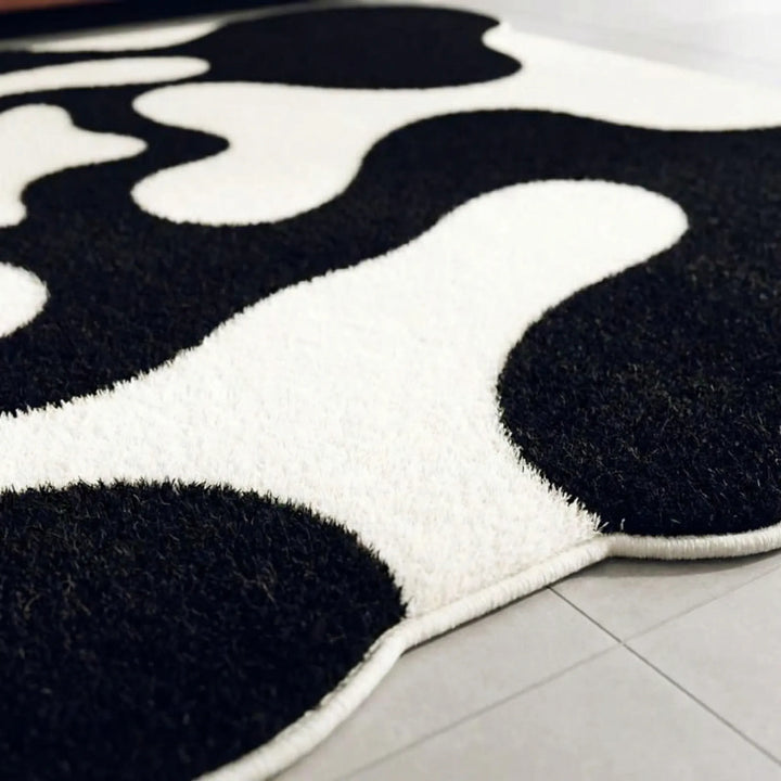Statement abstract wavy area rug, Flowique, featuring modern curves; a contemporary floor decor accent for stylish living rooms.