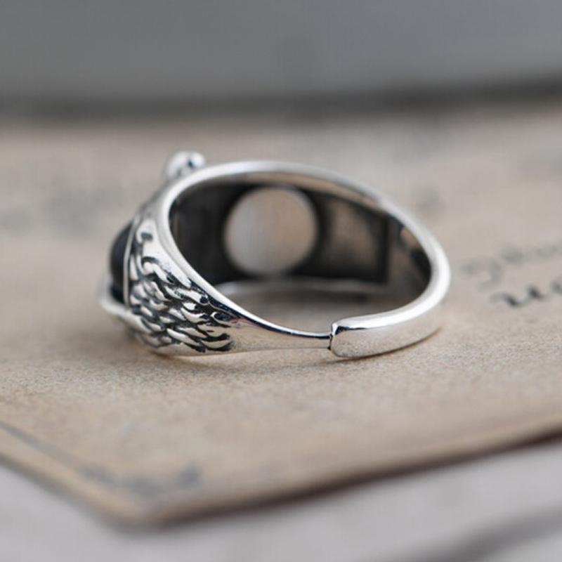 Close-up of a women's vintage owl eye ring, adjustable copper band