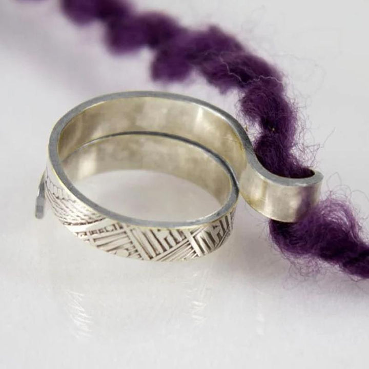 Handmade gift for crafters: an adjustable yarn guide ring, perfect crochet and knitting accessory.
