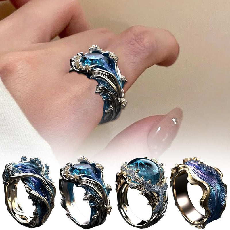 Close-up of ocean wave ring, showing intricate wave design in silver and blue resin