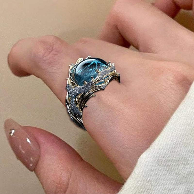 Stack of adjustable unisex ocean wave rings, showcasing variety of blue resin shades