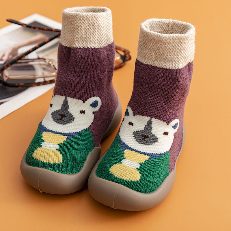 Soft sole toddler sock shoes featuring a smiling cartoon fox, ideal for indoor warmth