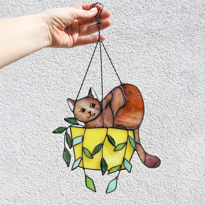 Whimsical stained glass cat in a plant pot, a beautiful animal-themed suncatcher