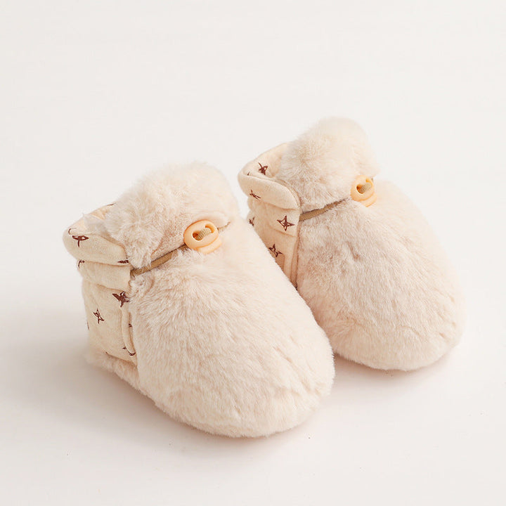 Side view of a gender-neutral plush cotton toddler shoe with anti-slip sole for new walkers
