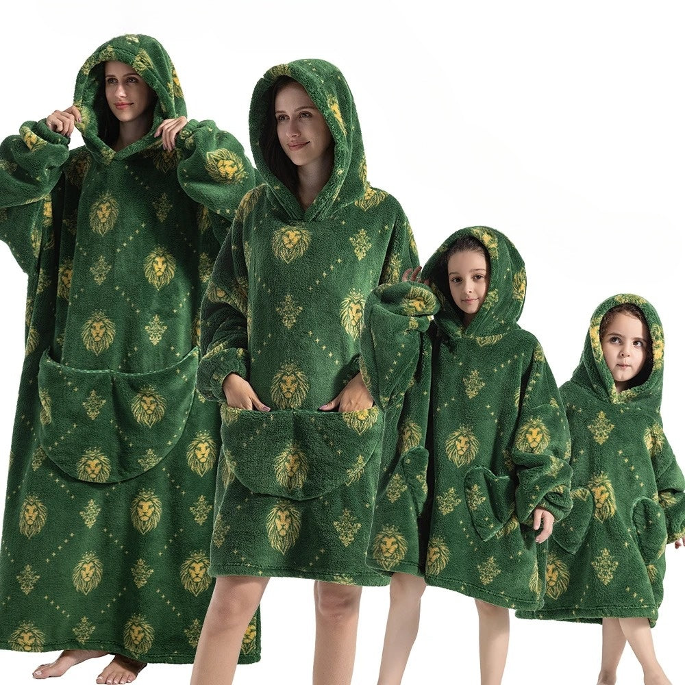 Vibrant pumpkin design hoodie blanket, providing cozy warmth for spooky season & autumn evenings.