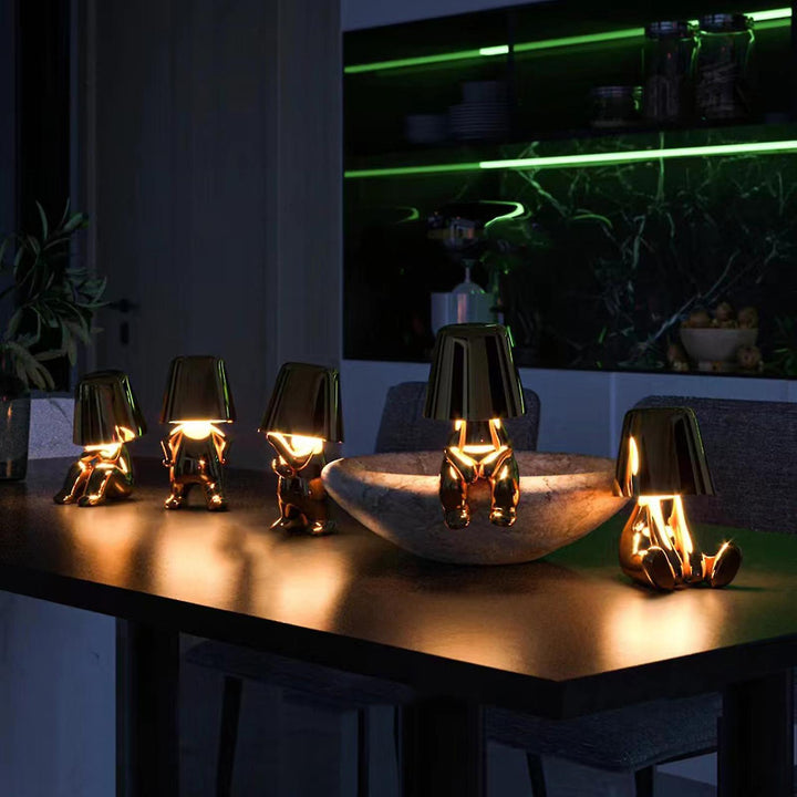 Rechargeable artistic table lamp with touch control & dimmable LED mood lighting.