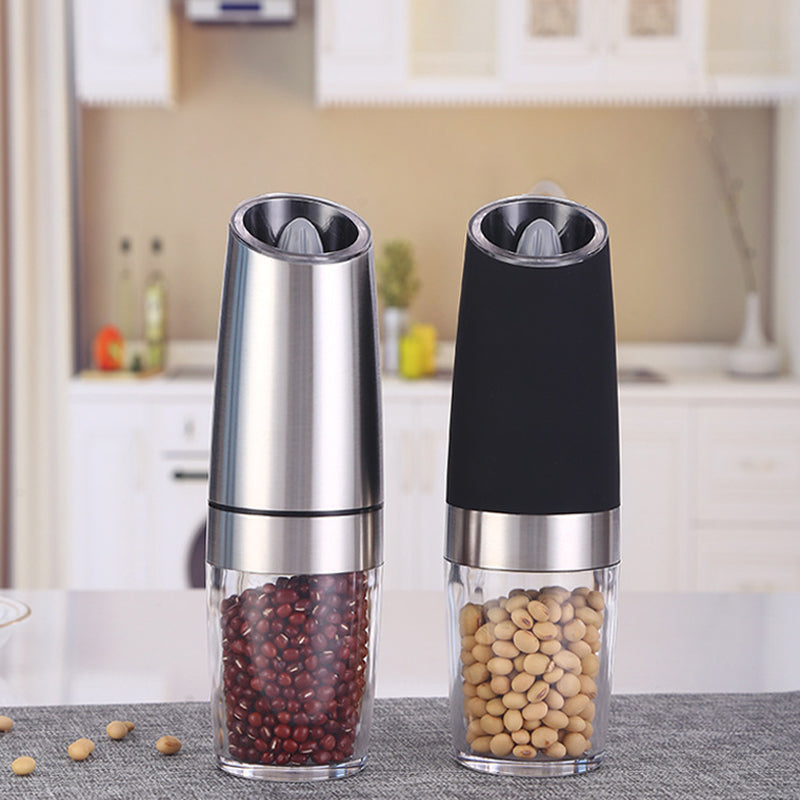 Close-up of electric spice grinder, showing ceramic grinding mechanism and easy-fill design, cookware