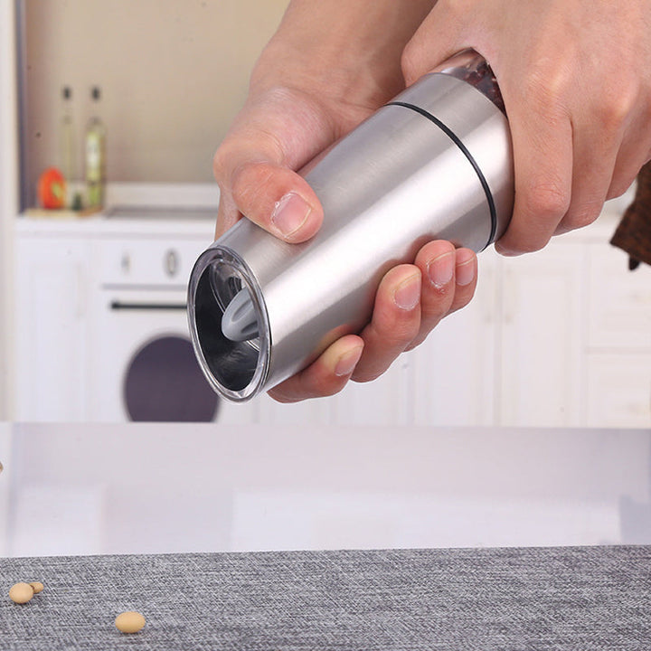 Gravity salt mill with transparent chamber, electric operation, modern kitchen gadget for seasoning