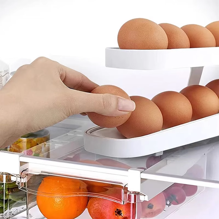 Child reaching for an egg from the bottom of the Automatic Rolling Egg Dispenser; easy access design.