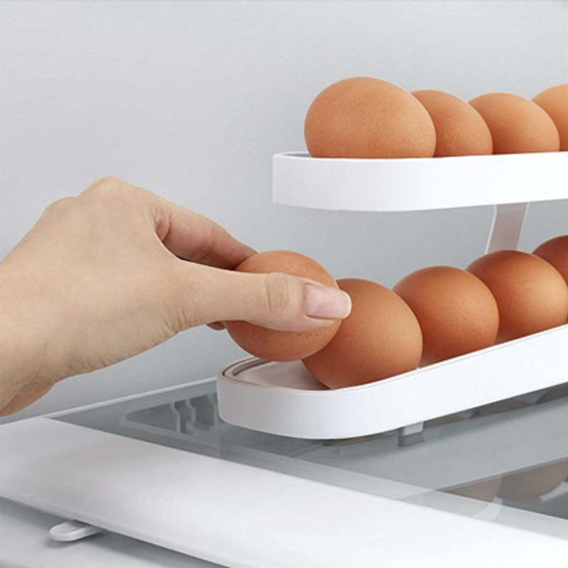 Automatic egg dispenser on a kitchen countertop, highlighting its sleek design and practical use.