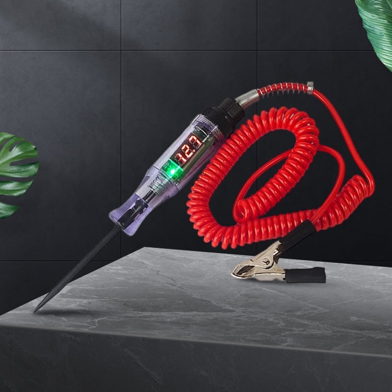 Hand holding an automotive electrical circuit test pen on a car battery terminal