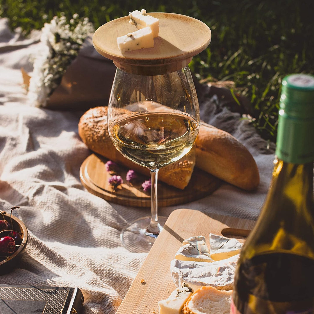 Stylish bamboo charcuterie topper, fits on wine glasses for convenient snacking during parties