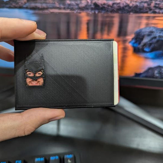 Durable card protector featuring a subtle superhero emblem, a sleek debit card accessory for fans.