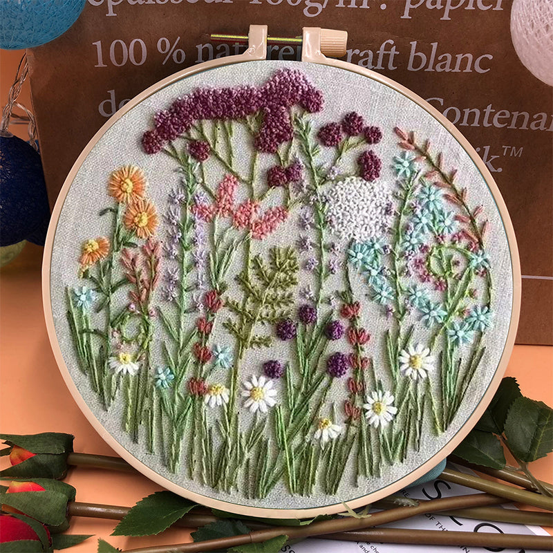 Finished botanical floral embroidery art, made with a beginner DIY needlework kit.