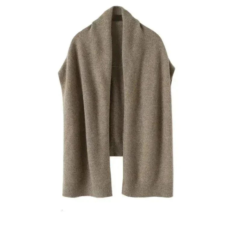 Cozy women's beige knitted shawl wrap, a versatile and soft polyester accessory for warmth.