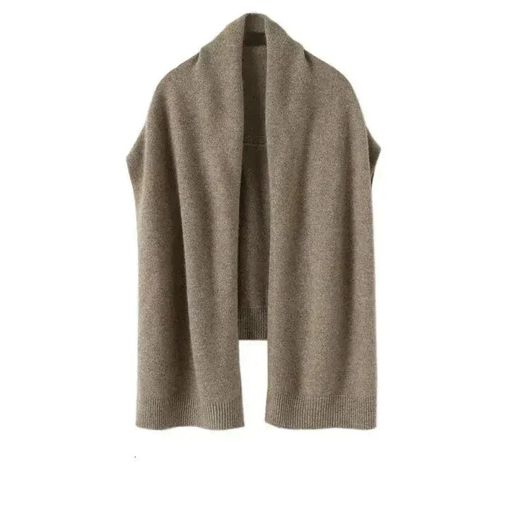 Cozy women's beige knitted shawl wrap, a versatile and soft polyester accessory for warmth.