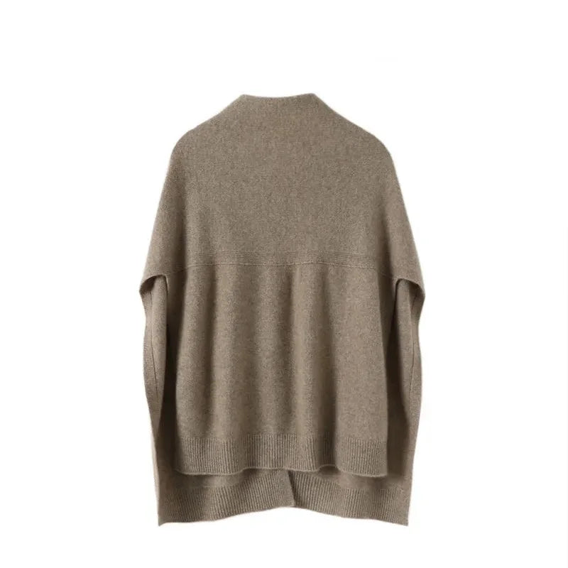 Elegant women's soft knitted cape in beige, ideal for layering and stylish autumn-winter outfits.