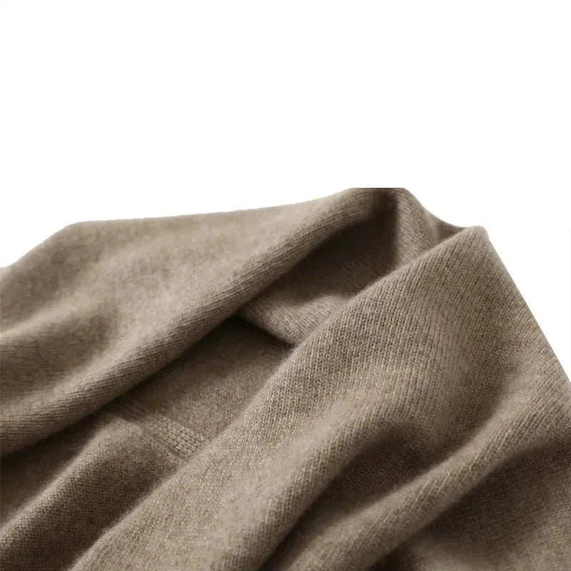 Fashionable women's beige knitted wrap, a comfortable and soft accessory for colder seasons.