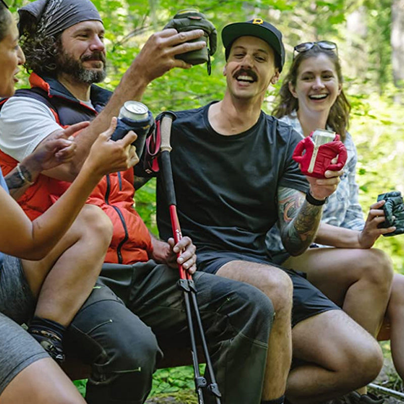 Person enjoying a cold drink in a can sleeve, keeping beverage chilled, practical accessory