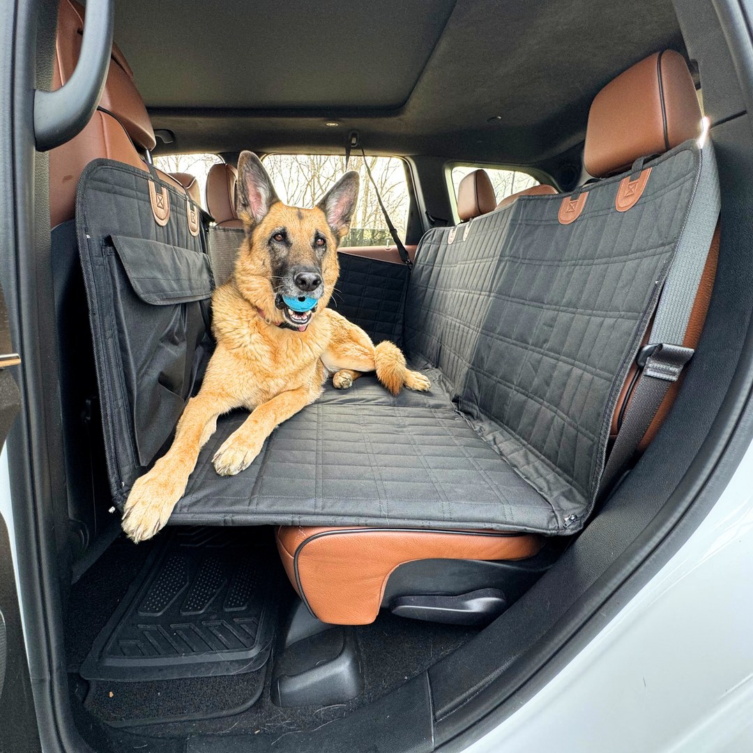 Black dog backseat extender with door covers. Waterproof pet car seat protection for travel.
