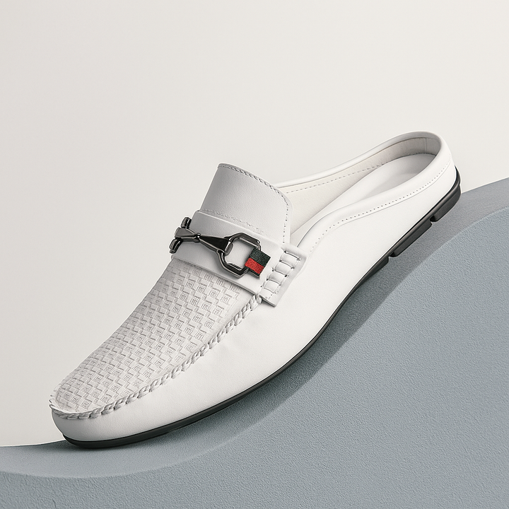 Classic black leather slip-on mules for women with a polished metal bit, versatile for any occasion.