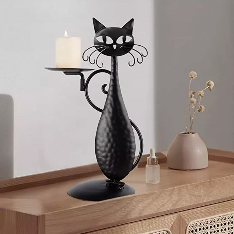 Black cat candle holder, designed to securely hold candles and enhance ambiance.